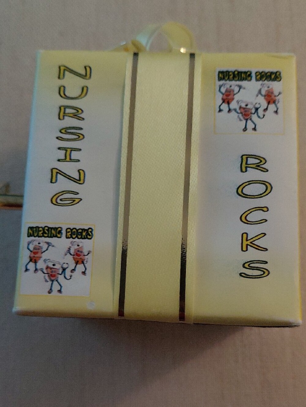 Nursing Rocks Yellow Gift Box with Decorative Bow Music Box - Picture 7 of 11